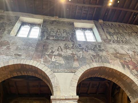 A wall with a painting on it
Description automatically generated